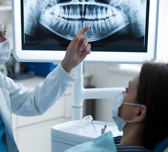 dentist-showing-patient-panoramic-x-ray-jaw